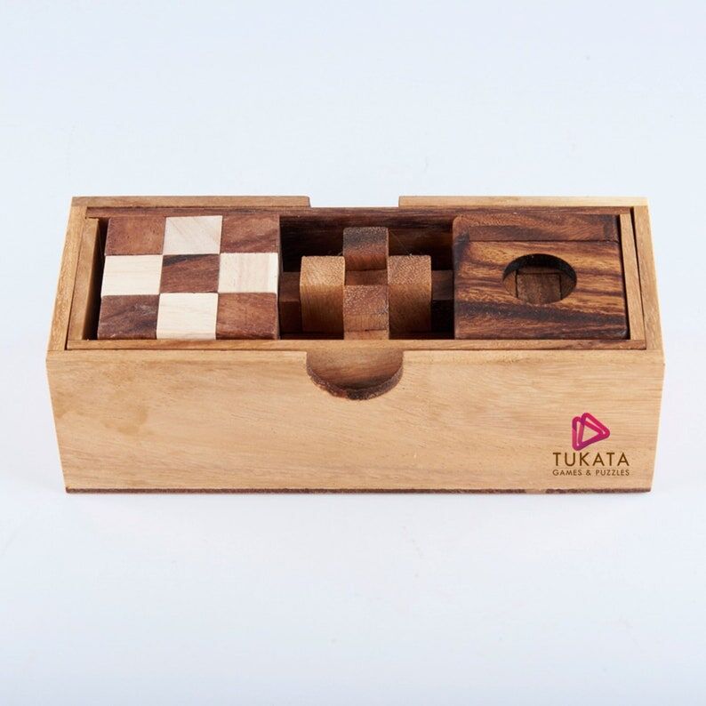 3 individual brainteaser wooden puzzles in a gift wooden box Price