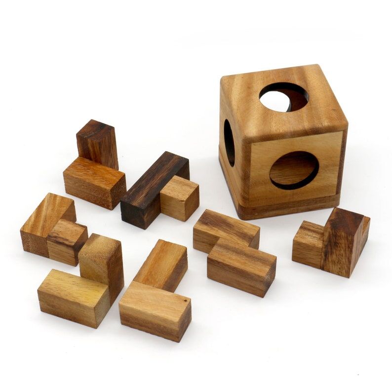3 individual brainteaser wooden puzzles in a gift wooden box Price