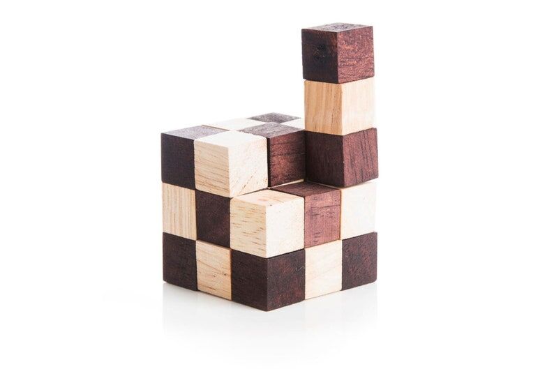 3 individual brainteaser wooden puzzles in a gift wooden box Price