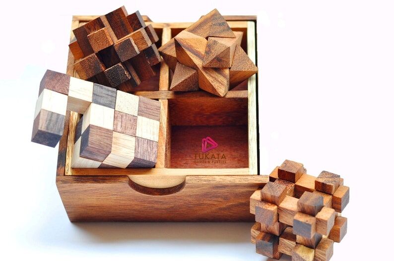 4 individual brainteaser wooden puzzles in a gift wooden box 4 individual brainteaser wooden puzzles in a gift wooden box